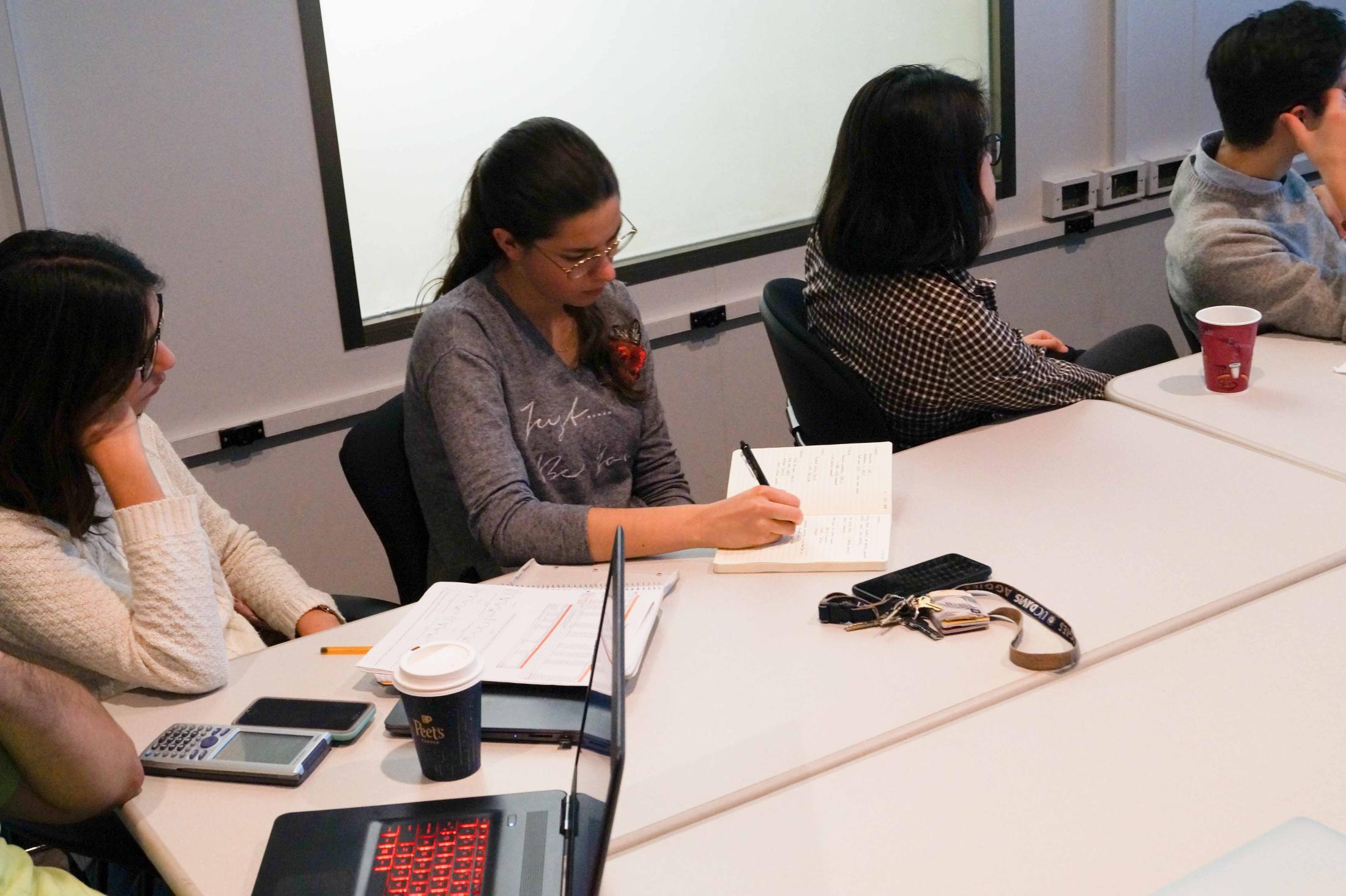 Students take notes during seminar