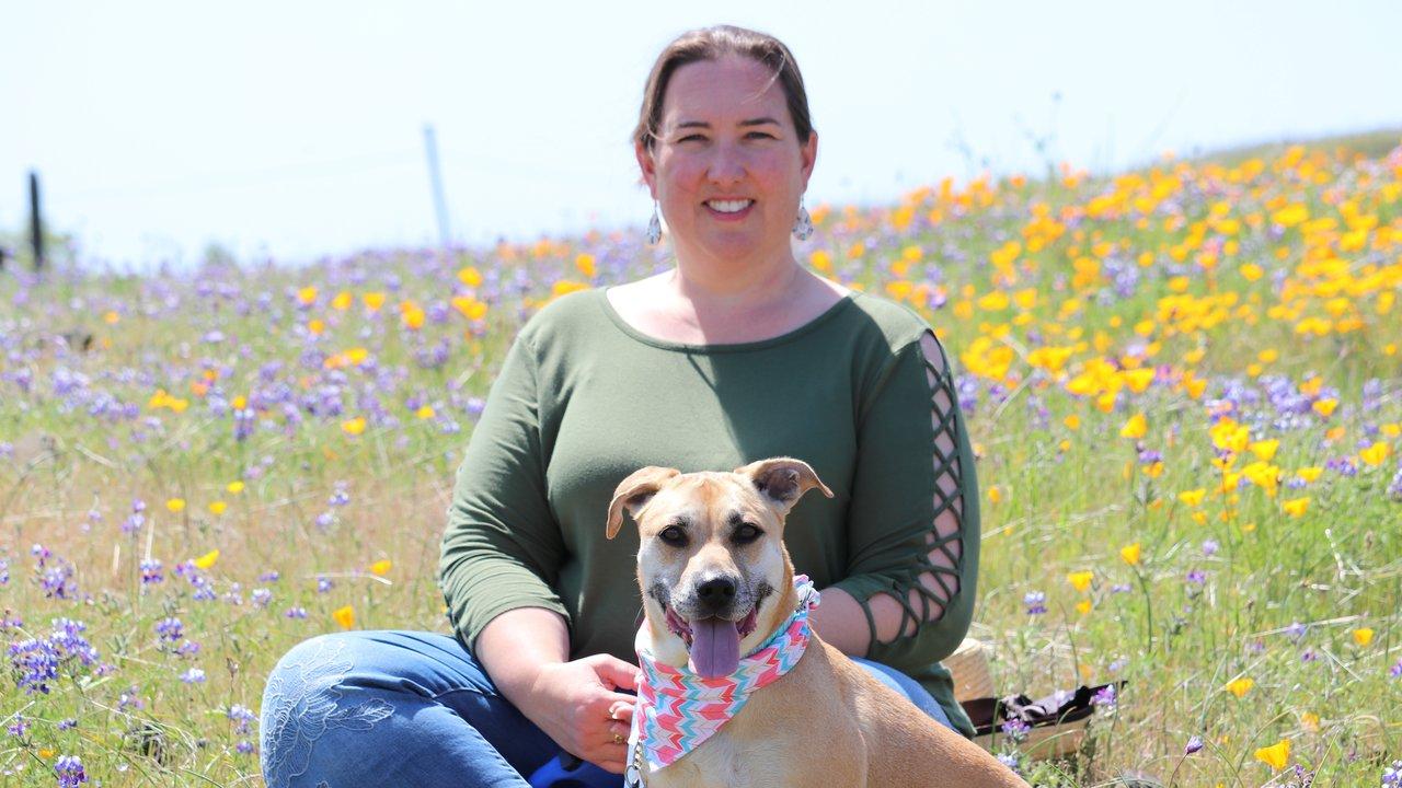 Carolyn Jones '01 and her dog Clara at Table Mountain in Butte County. Photo: Chris Fierros uc davis biological agricultural engineering alumni carolyn jones usda