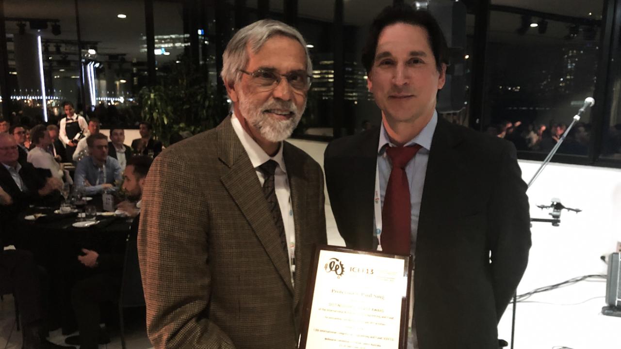 Dr. Paul Singh, left, with the president of IAEF, Dr. Roman Bucknow Dr. Paul Sing with his award