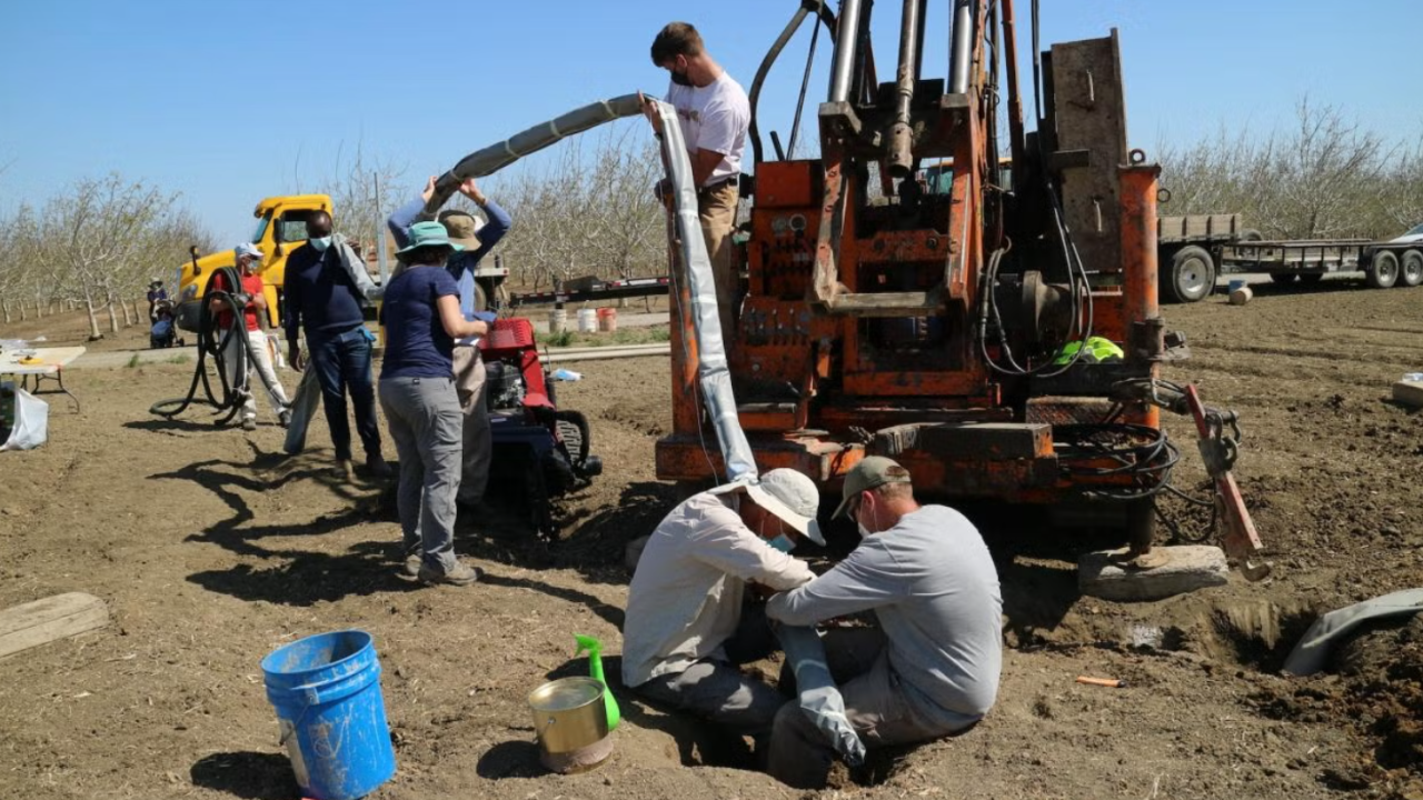 researchers in the field collecting water samples