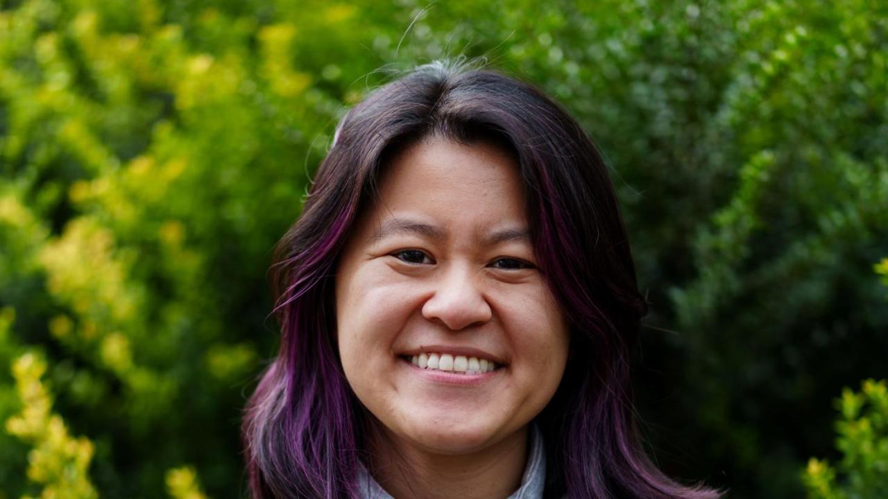 Vivian Vuong wearing a green jacket