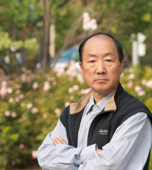 Distinguished Professor Emeritus Ning Pan sits with his arms folded across his chest