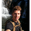 Picture of Bradley Soares in front of a waterfall