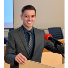 Picture of Brandon Roosenboom at a podium