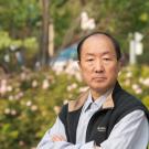 Distinguished Professor Emeritus Ning Pan sits with his arms folded across his chest